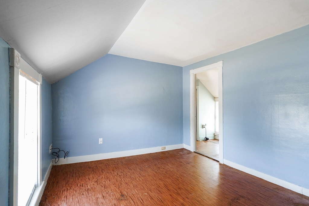 1255 Old Plainville Road New Bedford, MA 02745 - Photo 19 of 23 an empty room with wooden floor and windows