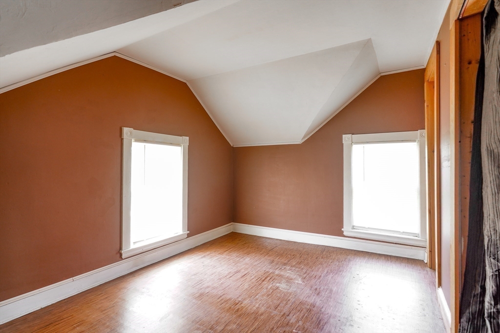 1255 Old Plainville Road New Bedford, MA 02745 - Photo 22 of 23 an empty room with wooden floor and windows