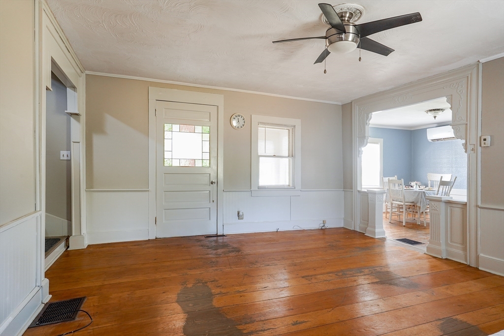 1255 Old Plainville Road New Bedford, MA 02745 - Photo 3 of 23 a bedroom with a bed and closet with mirror