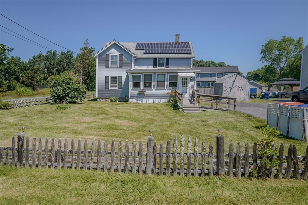 1255 Old Plainville Road New Bedford, MA 02745 - Photo 7 of 23 a view of a big house with a big yard and large trees