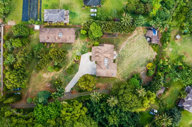 an aerial view of residential house with outdoor space and swimming pool