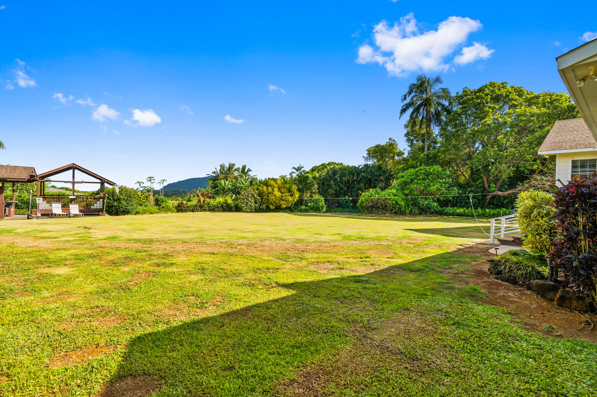 6201 B Kawaihau Road, Unit B Kapaa, HI 96746 - Photo 22 of 30 a view of an ocean and a yard