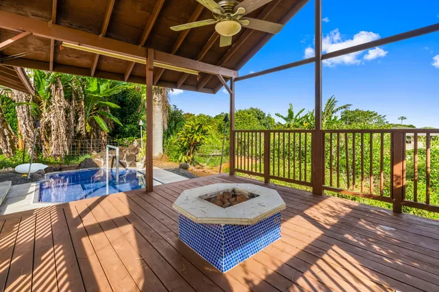 a view of a backyard with sitting area