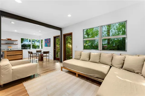 a living room with fireplace furniture and a flat screen tv