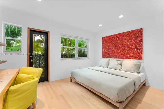 a living room with a couch and potted plant