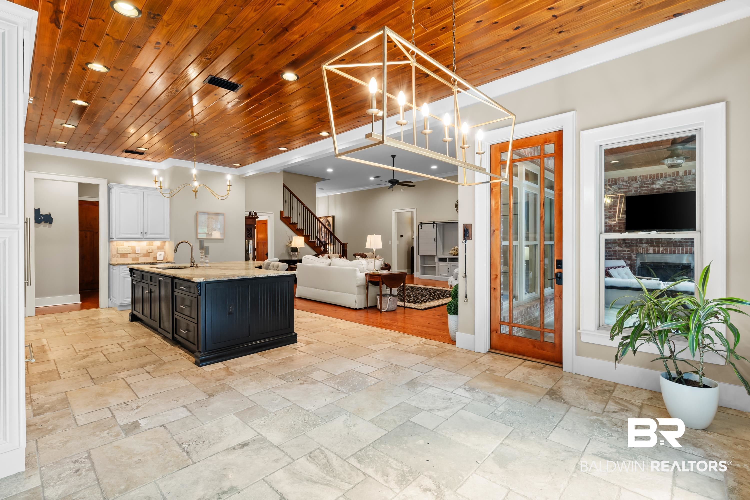 30057 Dolive Ridge Daphne, AL 36527 - Photo 16 of 55 Kitchen featuring wooden ceiling, hanging light fixtures, a kitchen island with sink, and sink