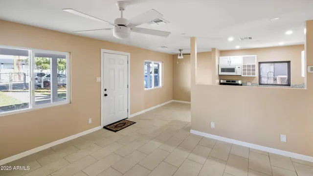 a view of a kitchen with a sink and cabinet area
