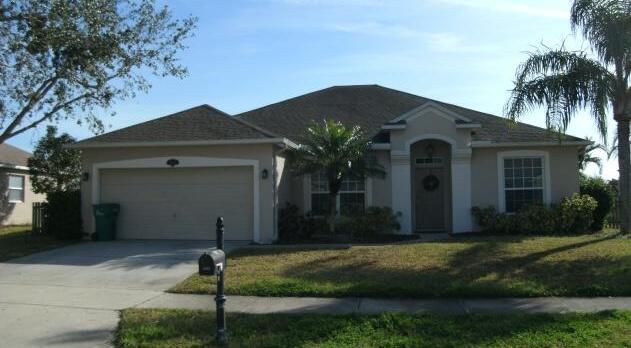 a front view of house with a yard