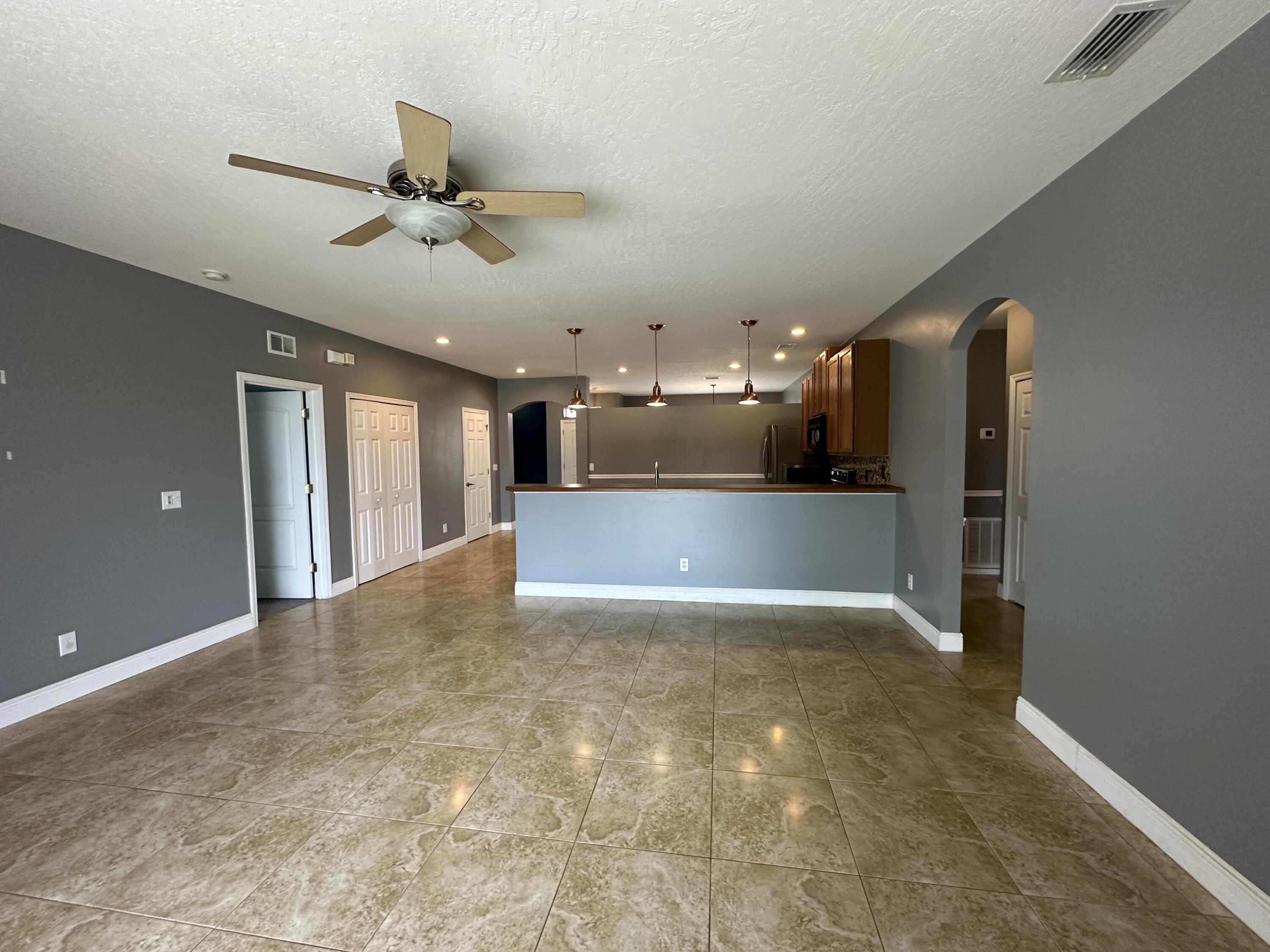 4010 Caparosa Circle Melbourne, FL 32940 - Photo 11 of 20 a view of a kitchen with a sink and a refrigerator