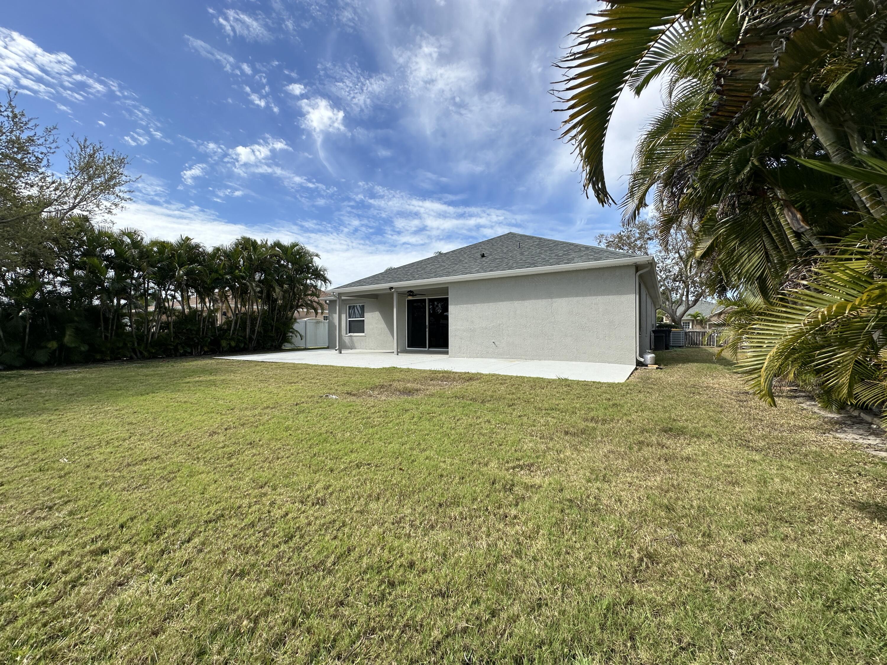 4010 Caparosa Circle Melbourne, FL 32940 - Photo 18 of 20 a backyard of a house with lots of green space