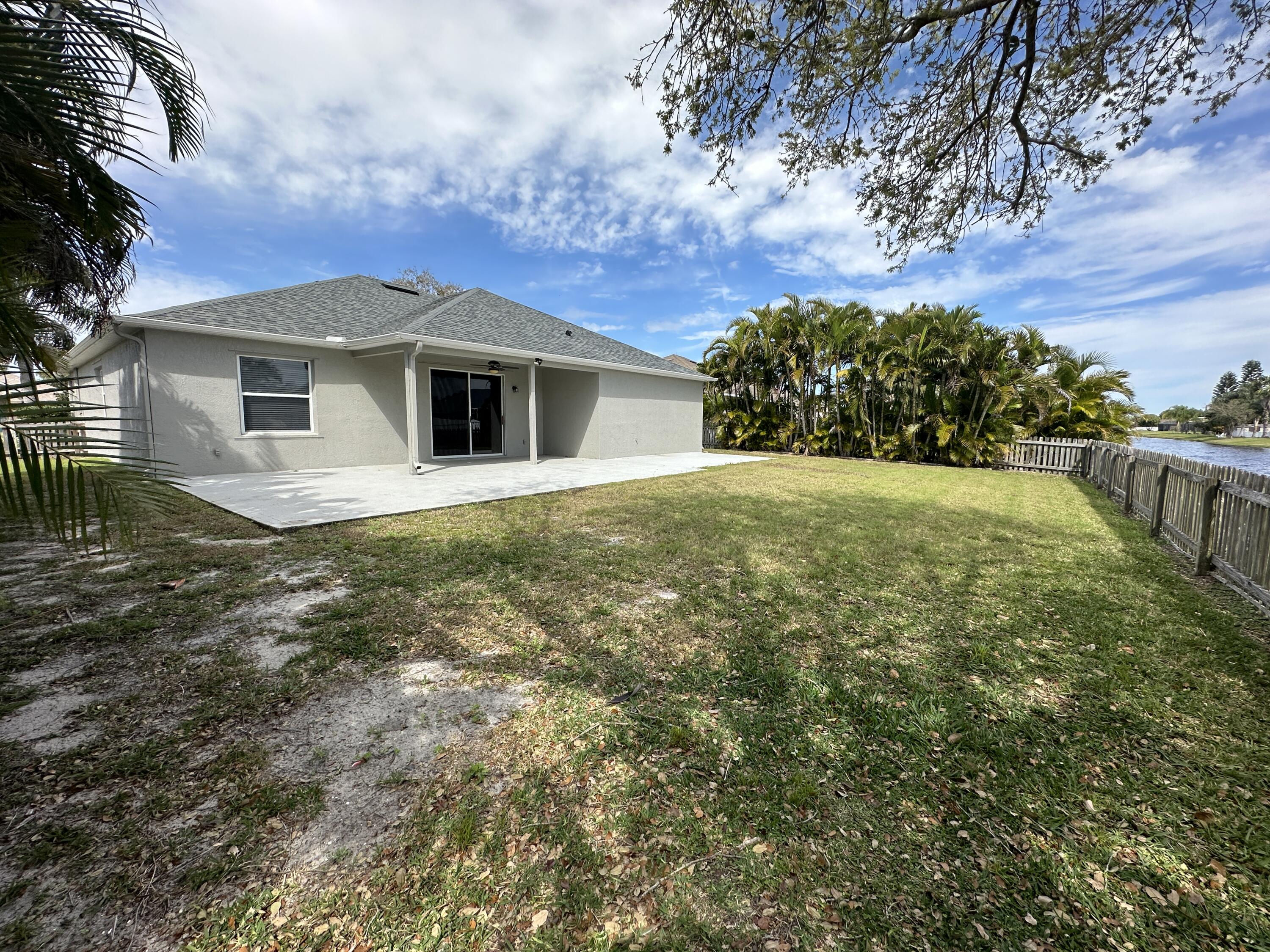 4010 Caparosa Circle Melbourne, FL 32940 - Photo 19 of 20 a front view of a house with a garden