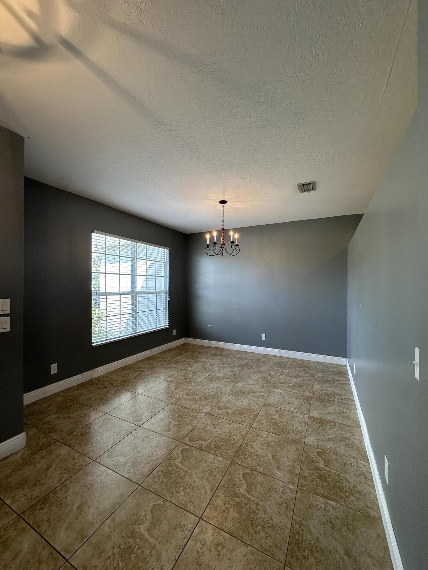 4010 Caparosa Circle Melbourne, FL 32940 - Photo 3 of 20 a view of empty room with windows