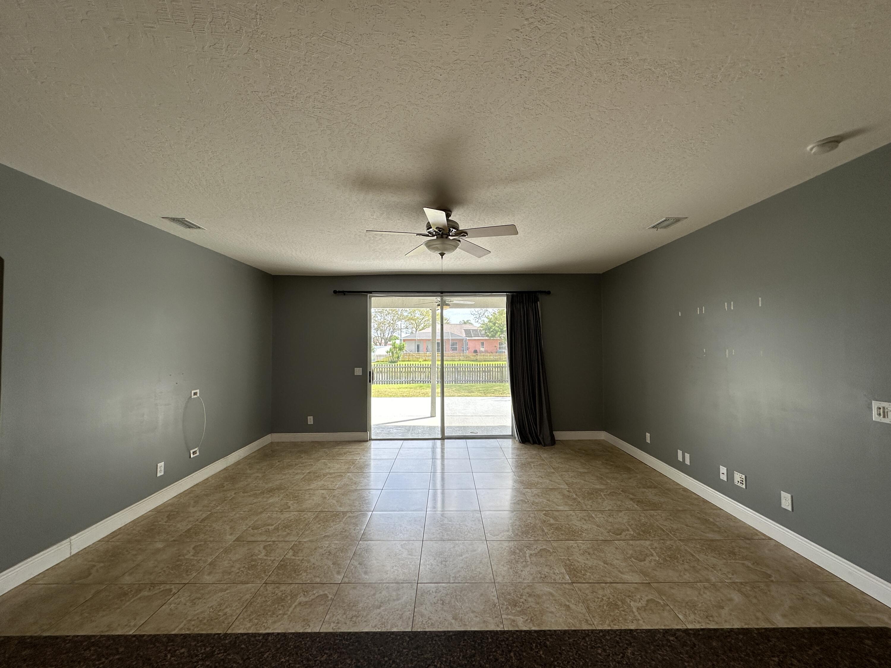 4010 Caparosa Circle Melbourne, FL 32940 - Photo 5 of 20 a view of an empty room with a window
