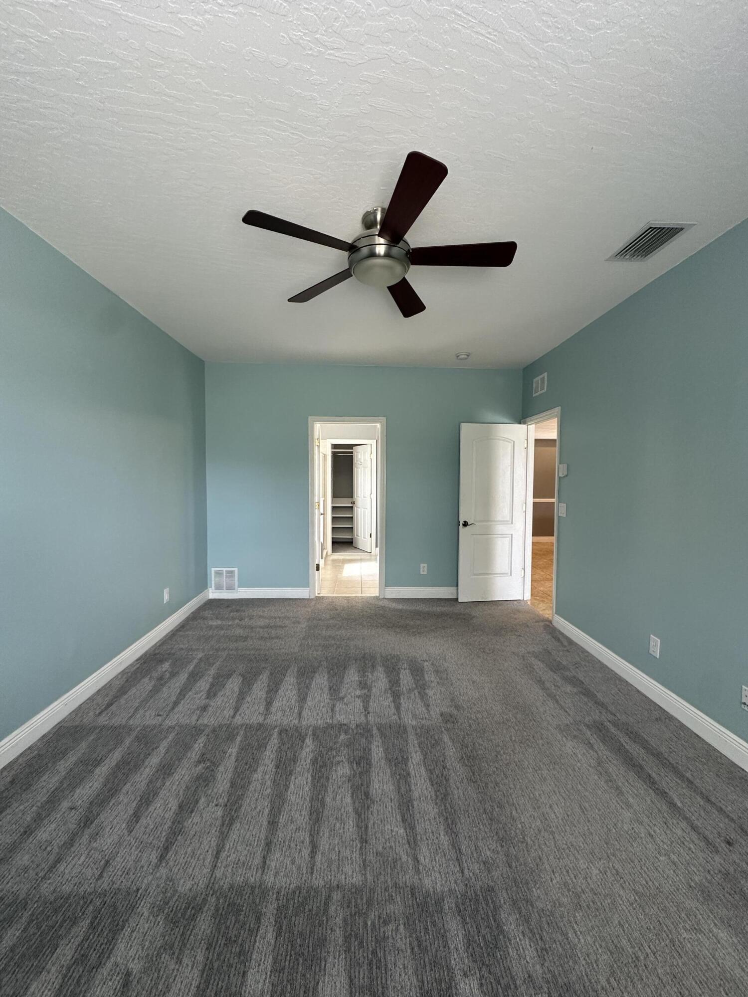 4010 Caparosa Circle Melbourne, FL 32940 - Photo 7 of 20 a view of an empty room with a window