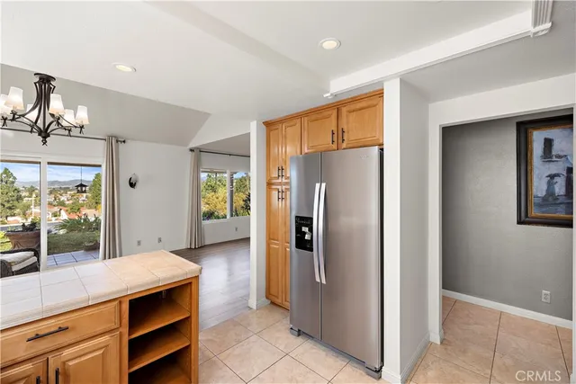 a kitchen with stainless steel appliances a refrigerator and cabinets