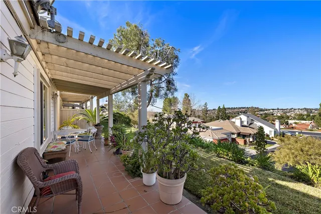a terrace with outdoor seating and city view
