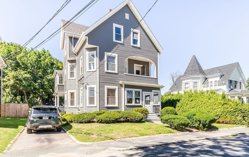 9 Denton Street, Unit 3 Brockton, MA 02301 - Photo 1 of 5 a front view of a house with a garden