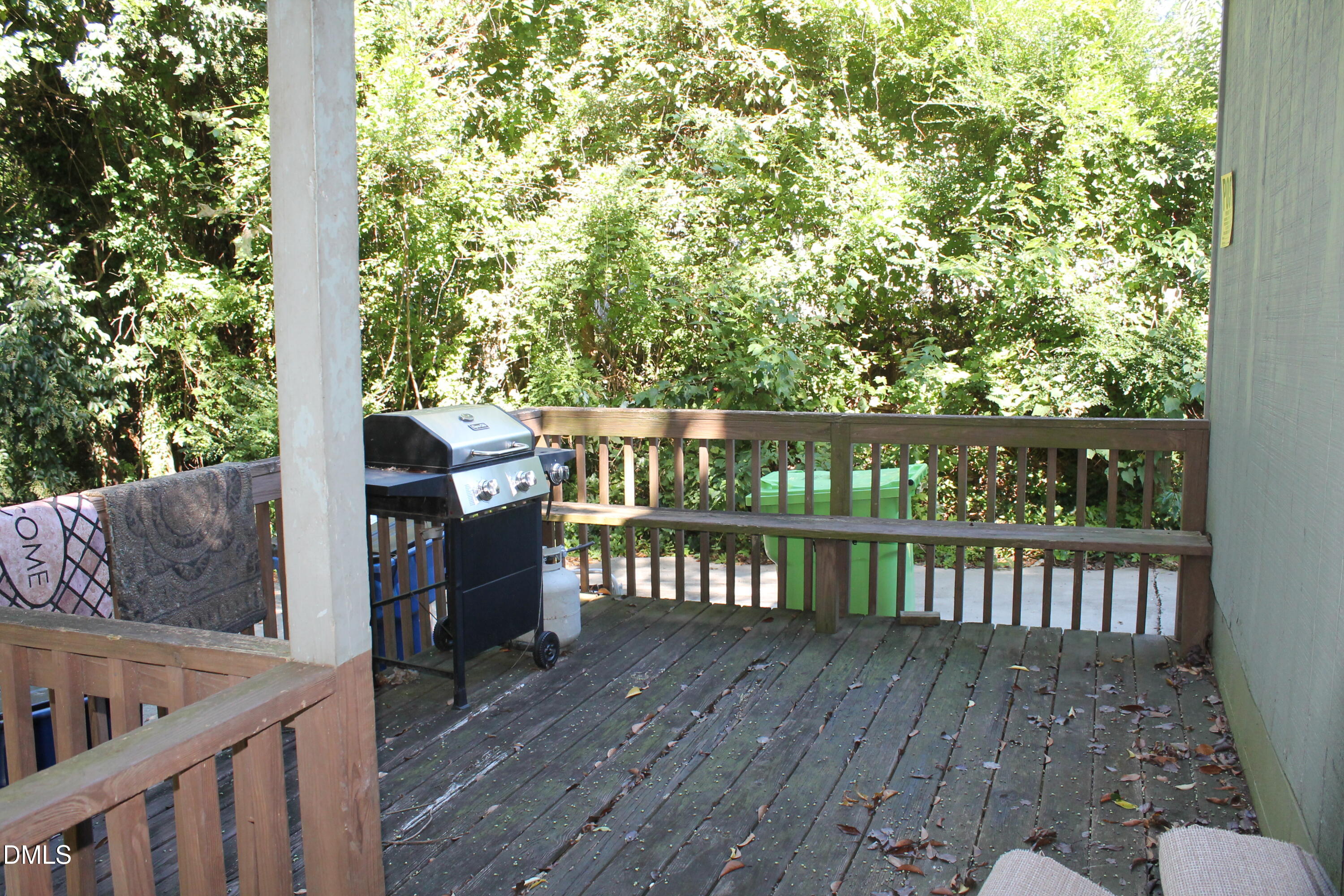 103 Gary Street Raleigh, NC 27606 - Photo 4 of 6 a view of a wooden deck and a yard