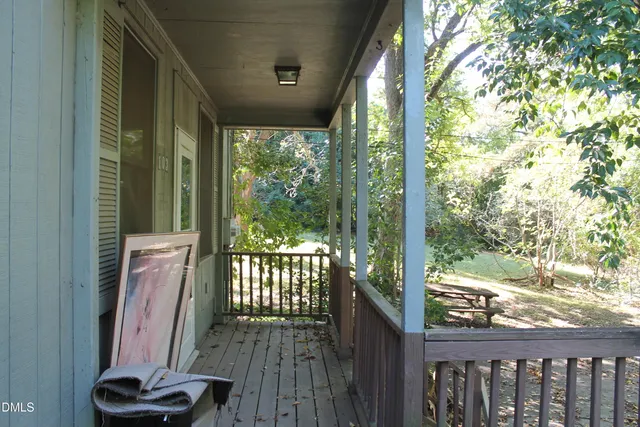 a view of a balcony with wooden floor