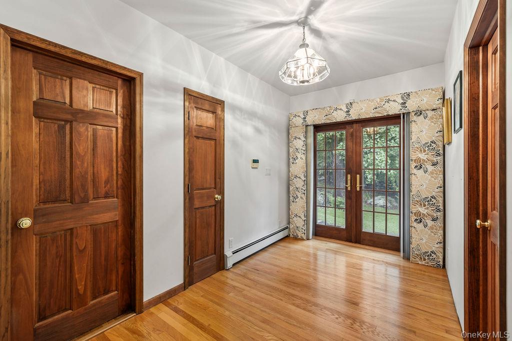 289 Seven Springs Mountain Road Monroe, NY 10950 - Photo 16 of 25 wooden floor in an empty room with a window