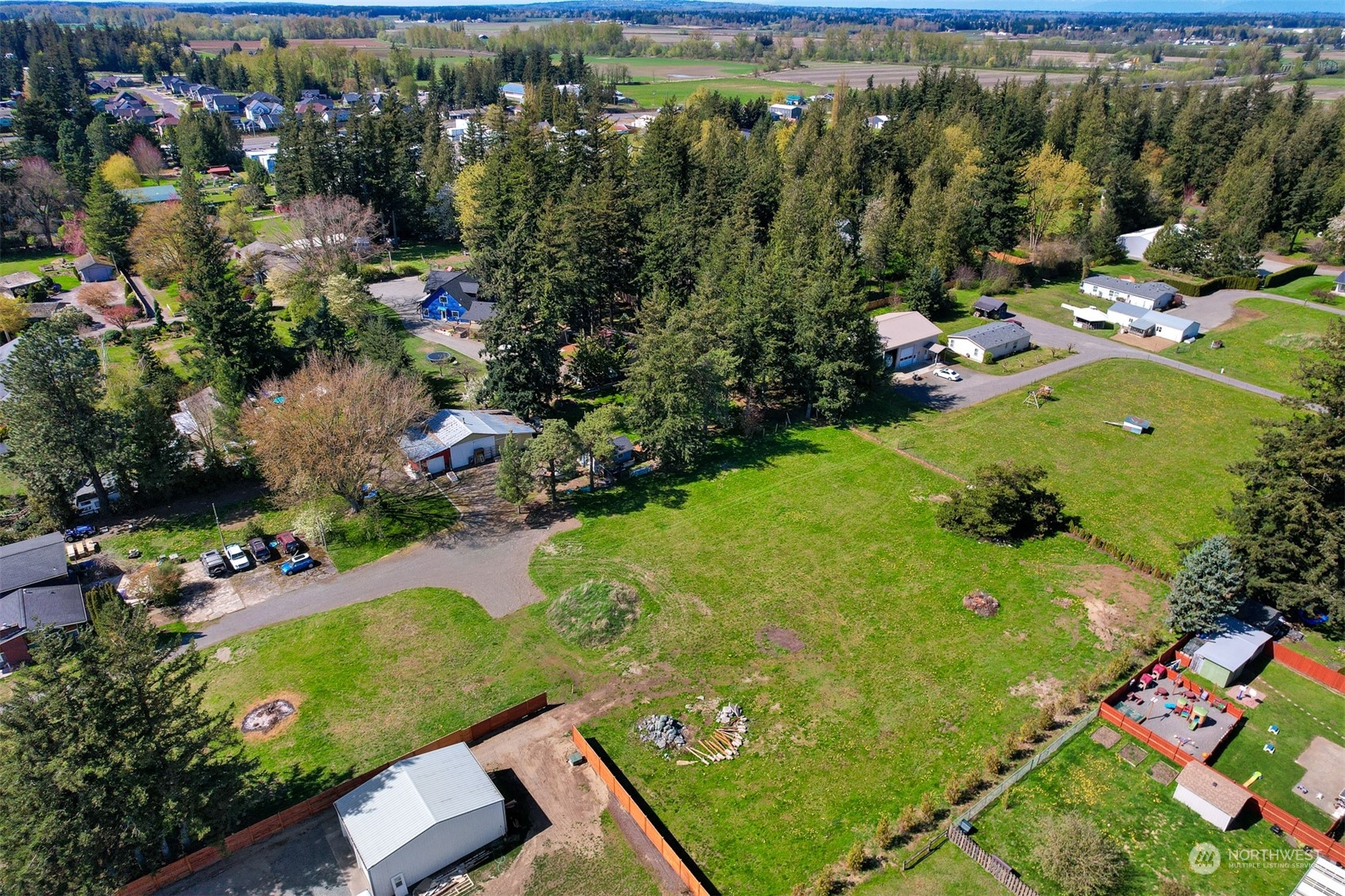202 East Wiser Lake Road Lynden, WA 98264 - Photo 1 of 12 an aerial view of a residential houses with outdoor space