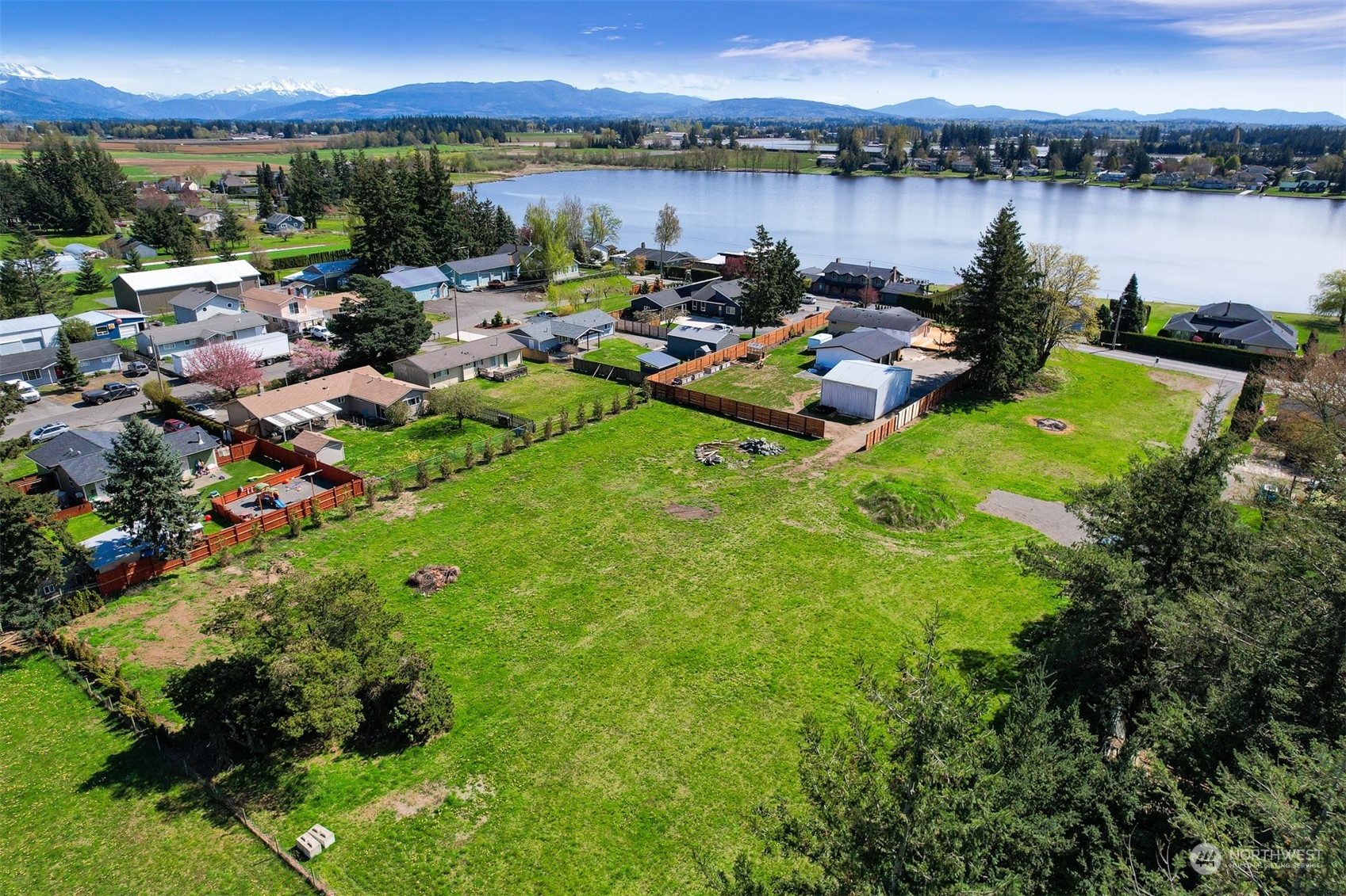 202 East Wiser Lake Road Lynden, WA 98264 - Photo 7 of 12 a view of a lake with a table and chairs