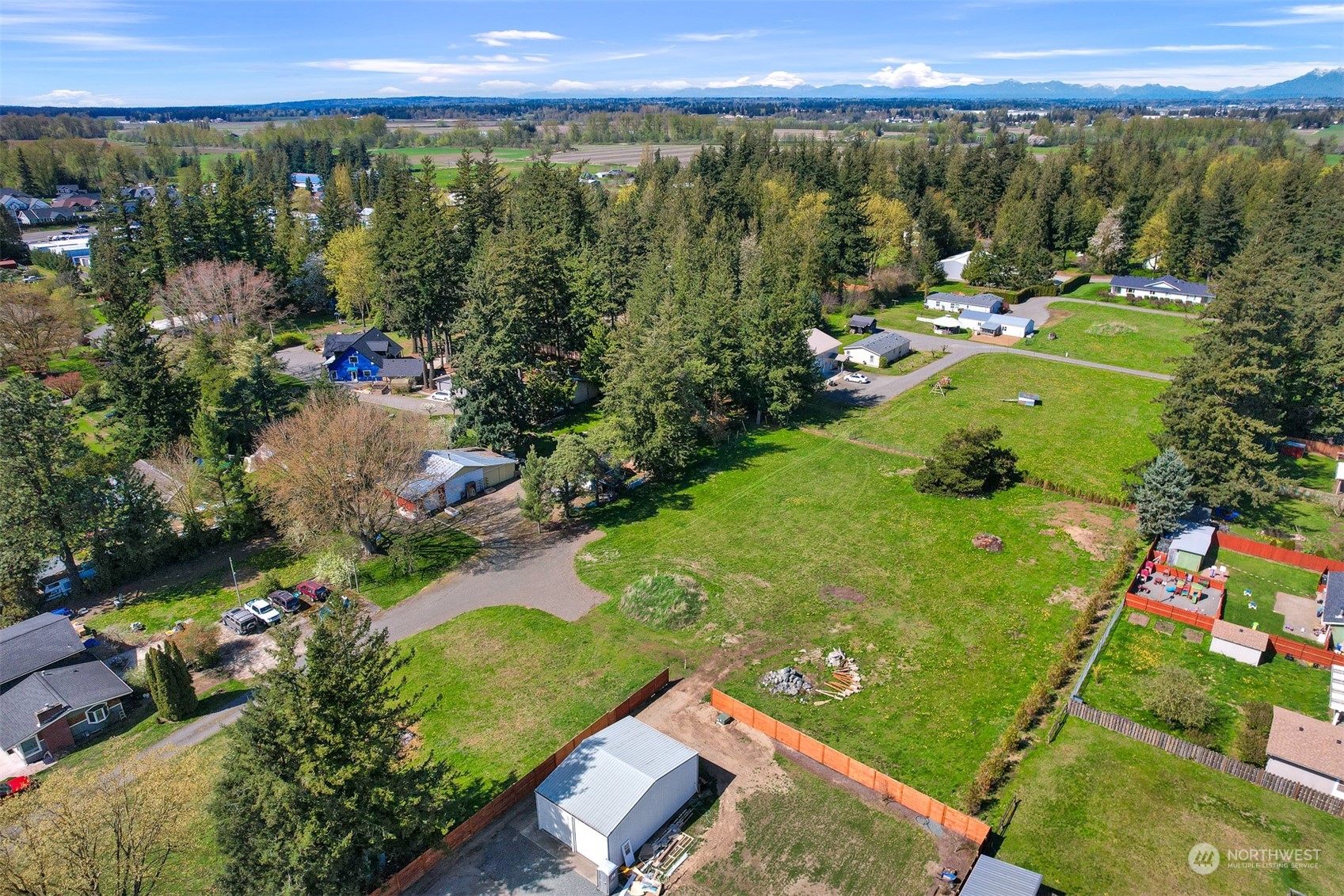 202 East Wiser Lake Road Lynden, WA 98264 - Photo 9 of 12 a view of a city with lush green forest