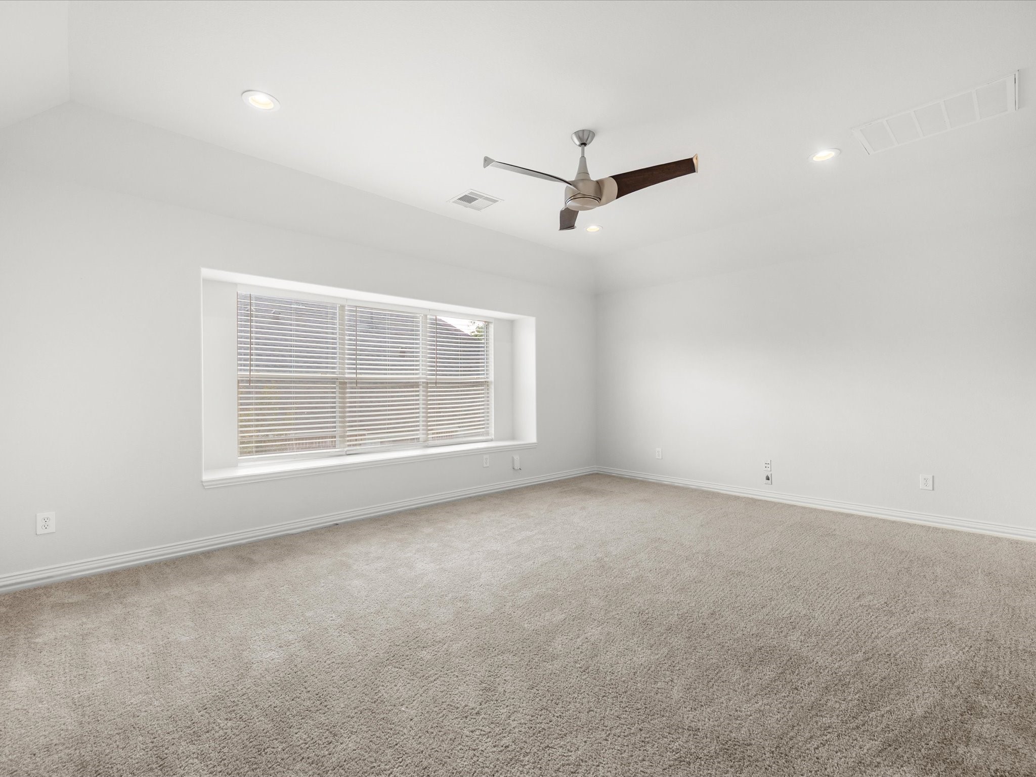 323 Arbor Ridge Lane Conroe, TX 77384 - Photo 30 of 40 Upstairs game room and here's where the fun lives. ?? Movie nights, playroom, teen hangout, home gym. Vaulted ceiling, cozy carpet, and enough space to make it yours.