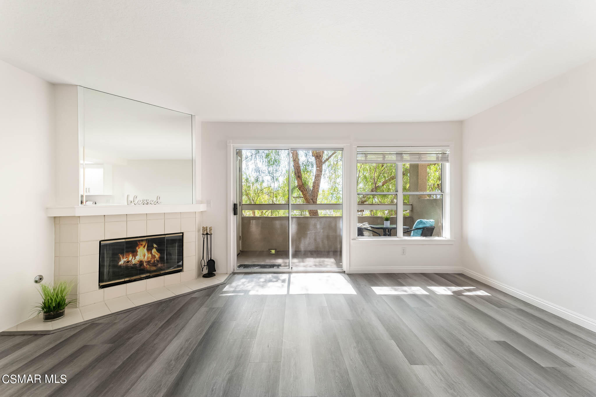 2731 Erringer Road, Unit 54 Simi Valley, CA 93065 - Photo 1 of 34 an empty room with large windows and fireplace