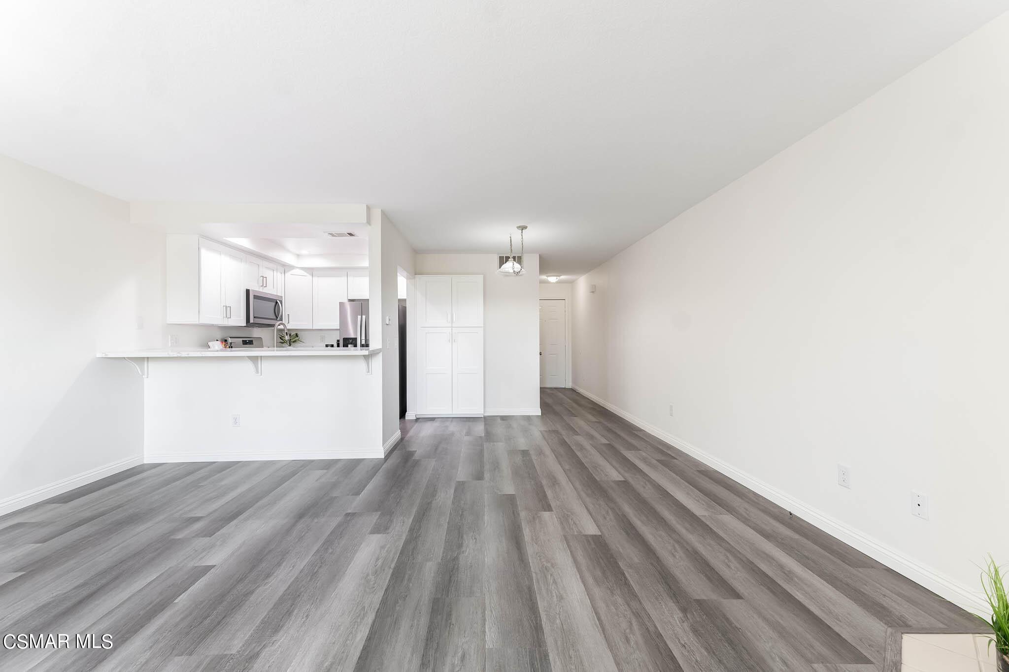 2731 Erringer Road, Unit 54 Simi Valley, CA 93065 - Photo 12 of 34 a view of kitchen and wooden floor