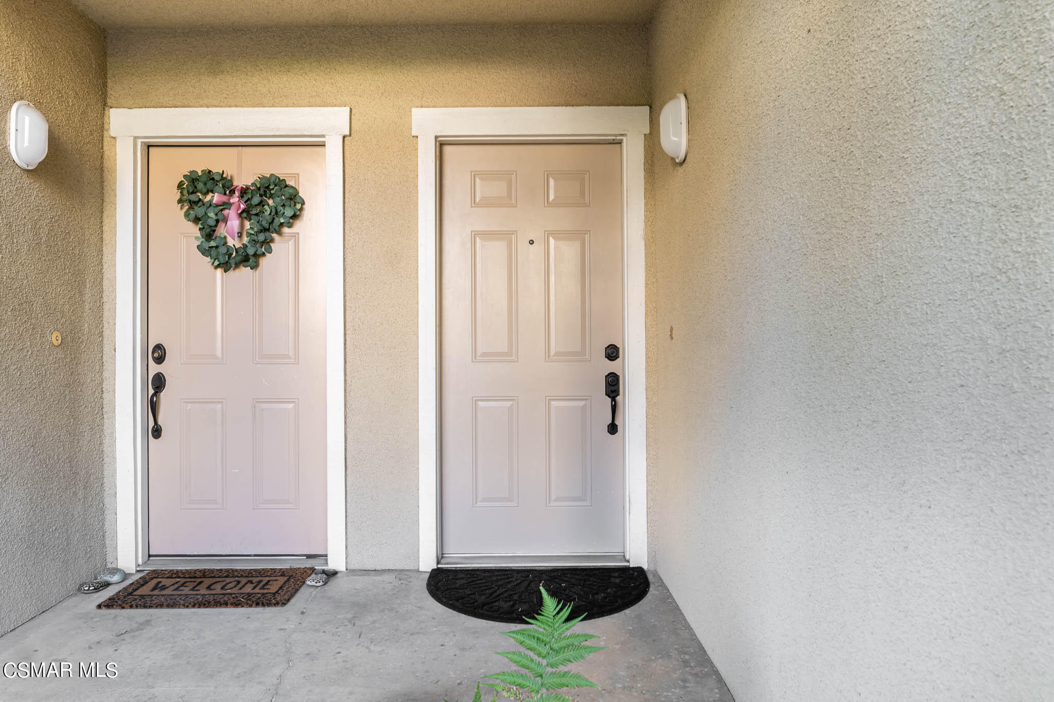 2731 Erringer Road, Unit 54 Simi Valley, CA 93065 - Photo 18 of 34 a view of a hallway with wooden floor and a dining room
