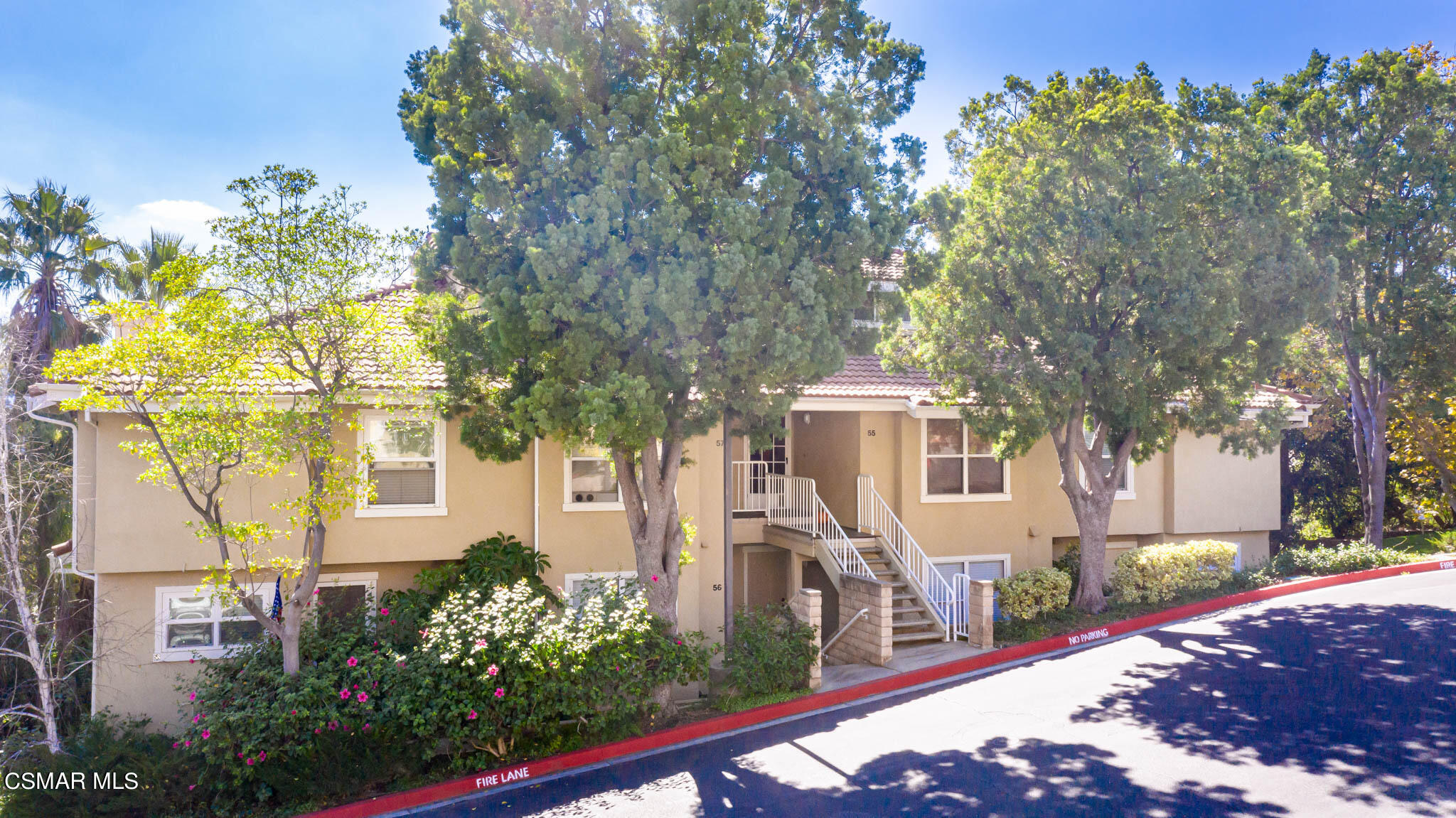 2731 Erringer Road, Unit 54 Simi Valley, CA 93065 - Photo 20 of 34 a front view of a house with garden