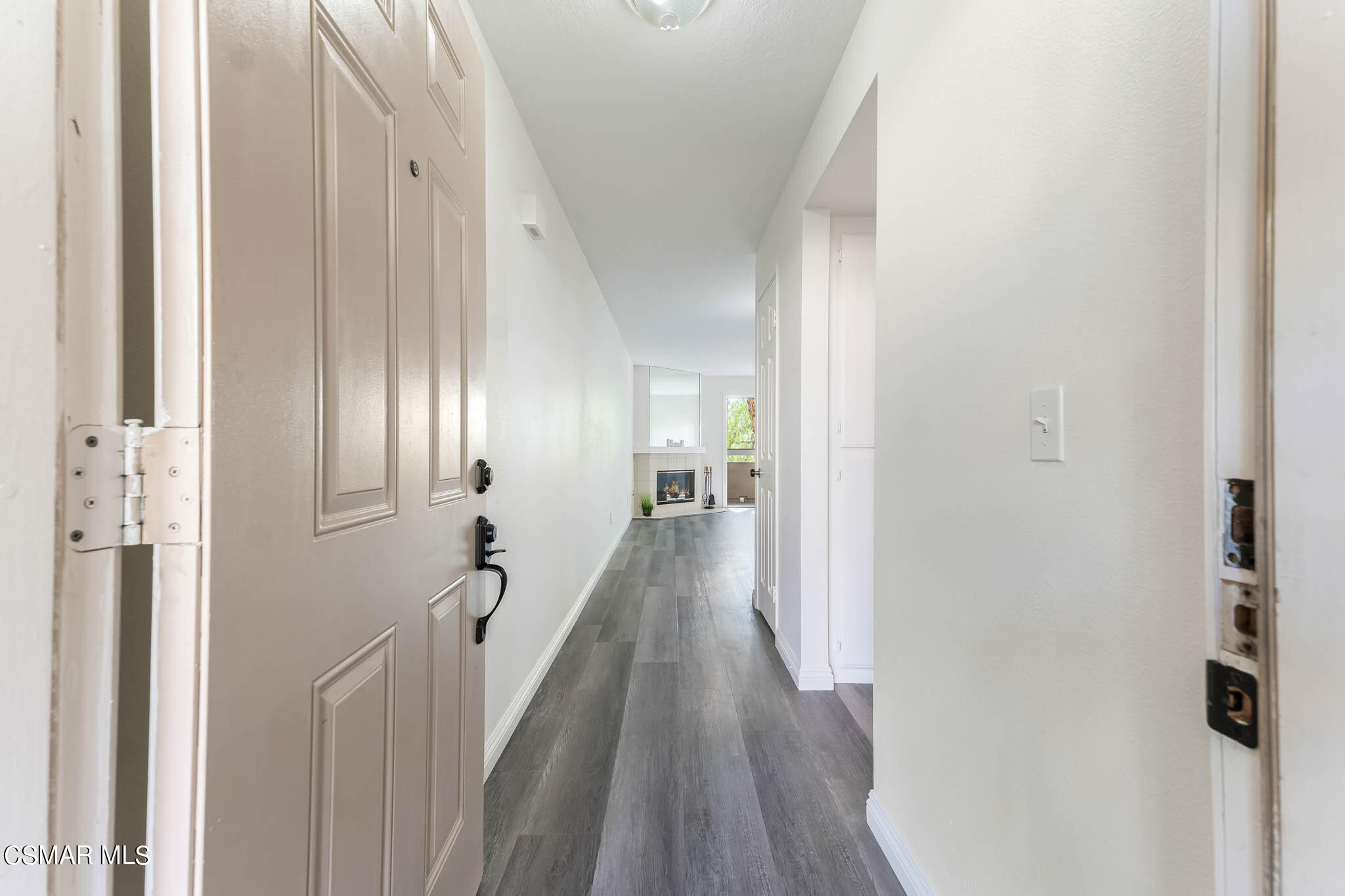 2731 Erringer Road, Unit 54 Simi Valley, CA 93065 - Photo 2 of 34 a view of a hallway with wooden floor and staircase