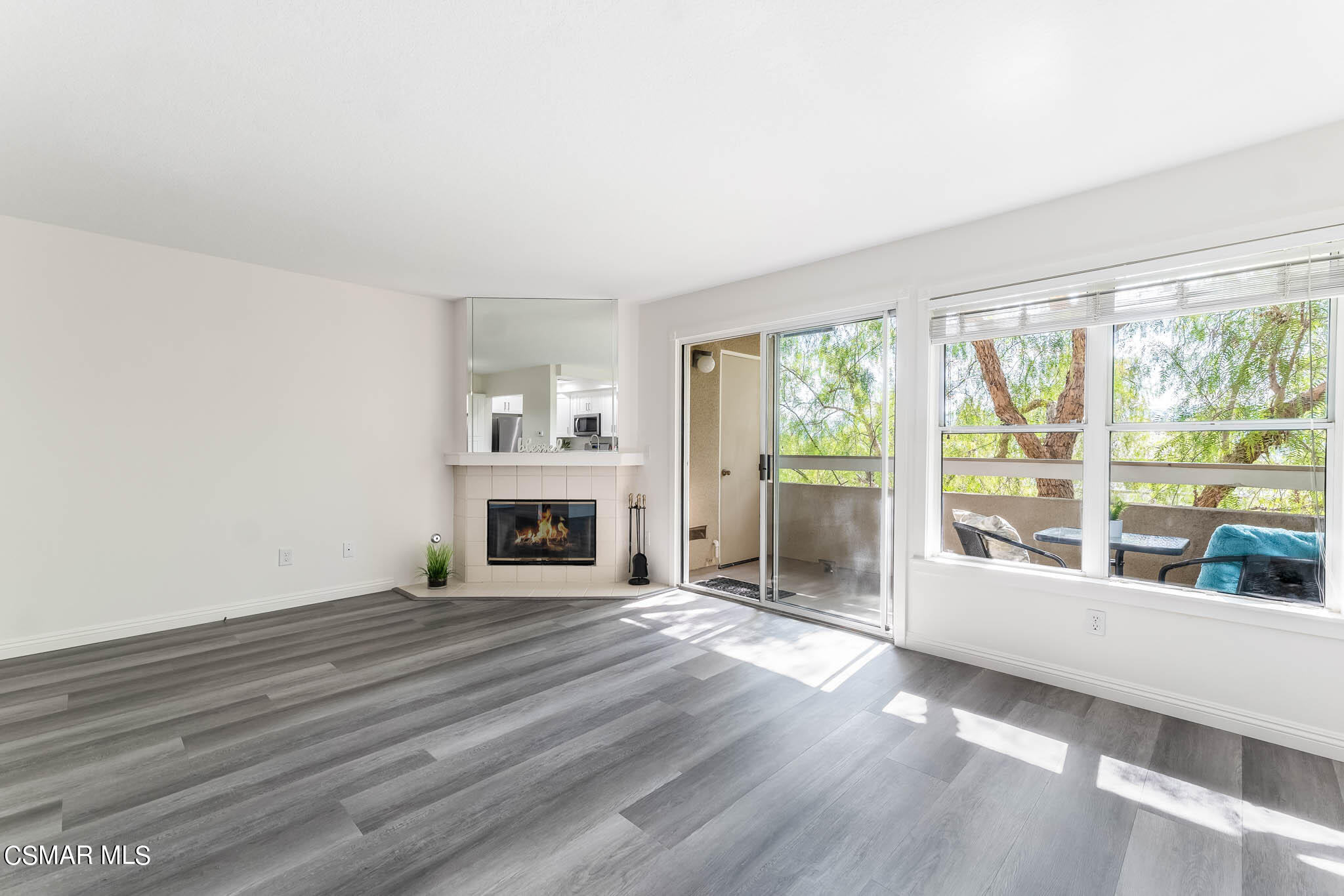 2731 Erringer Road, Unit 54 Simi Valley, CA 93065 - Photo 7 of 34 a view of an empty room with wooden floor and a window