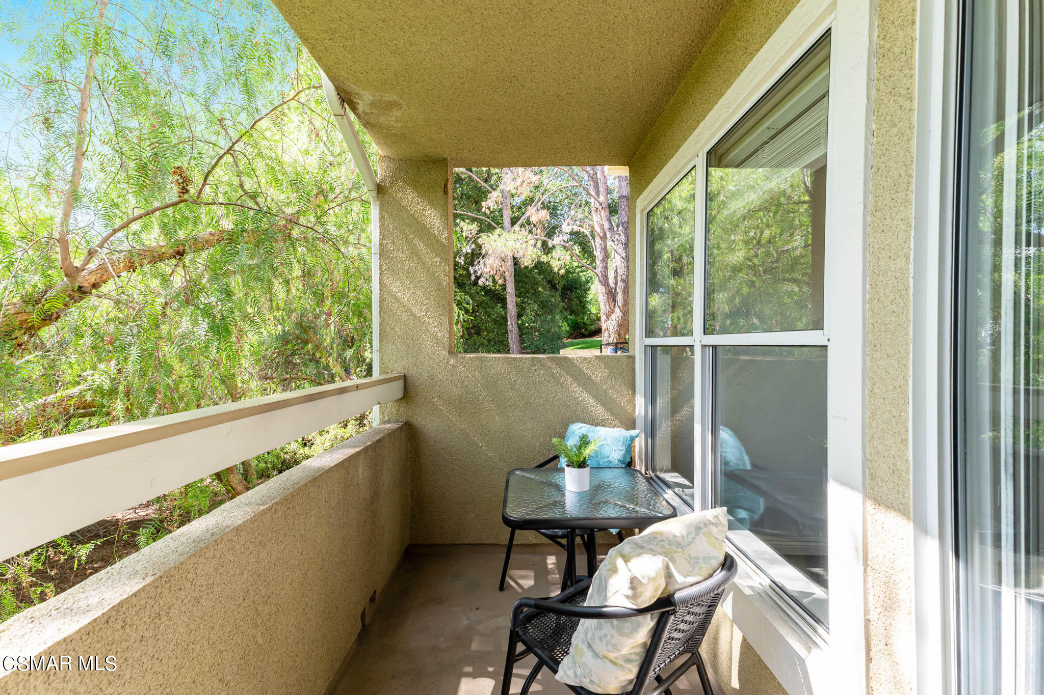 2731 Erringer Road, Unit 54 Simi Valley, CA 93065 - Photo 9 of 34 a living room with a large window and chairs
