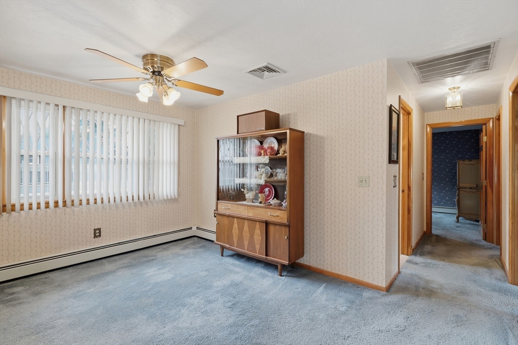 10 Deluca Road Milford, MA 01757 - Photo 9 of 37 wooden floor in an empty room with a window