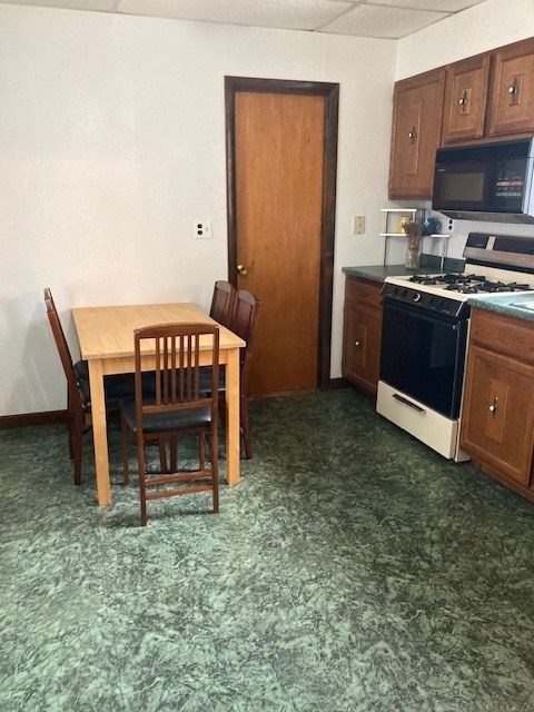 90 Prospect Street, Unit 2 Somerville, MA 02143 - Photo 14 of 27 a view of kitchen with furniture and a fireplace