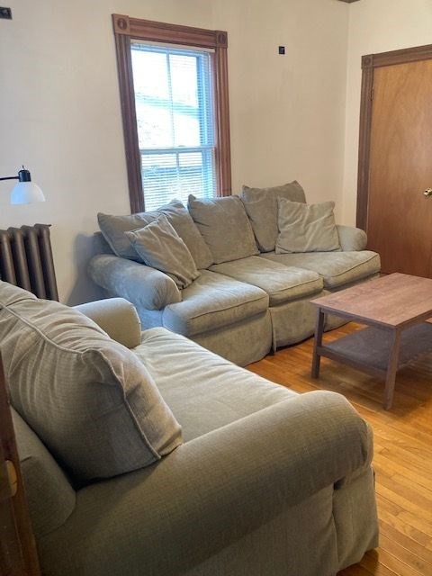 90 Prospect Street, Unit 2 Somerville, MA 02143 - Photo 2 of 27 a bedroom with two beds and a window