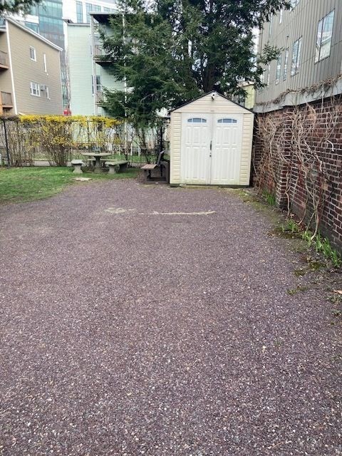 90 Prospect Street, Unit 2 Somerville, MA 02143 - Photo 26 of 27 a view of a house with a yard and garage