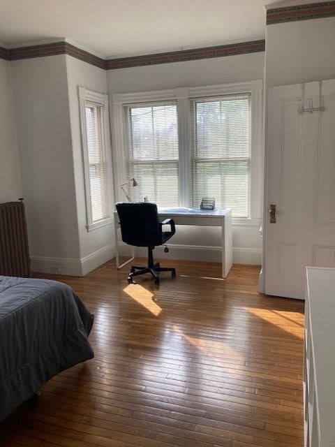 90 Prospect Street, Unit 2 Somerville, MA 02143 - Photo 5 of 27 a living room with furniture and a large window