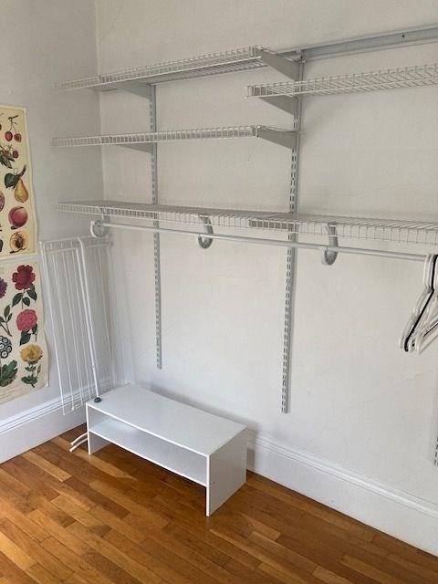 90 Prospect Street, Unit 2 Somerville, MA 02143 - Photo 7 of 27 a view of an empty room with wooden floor