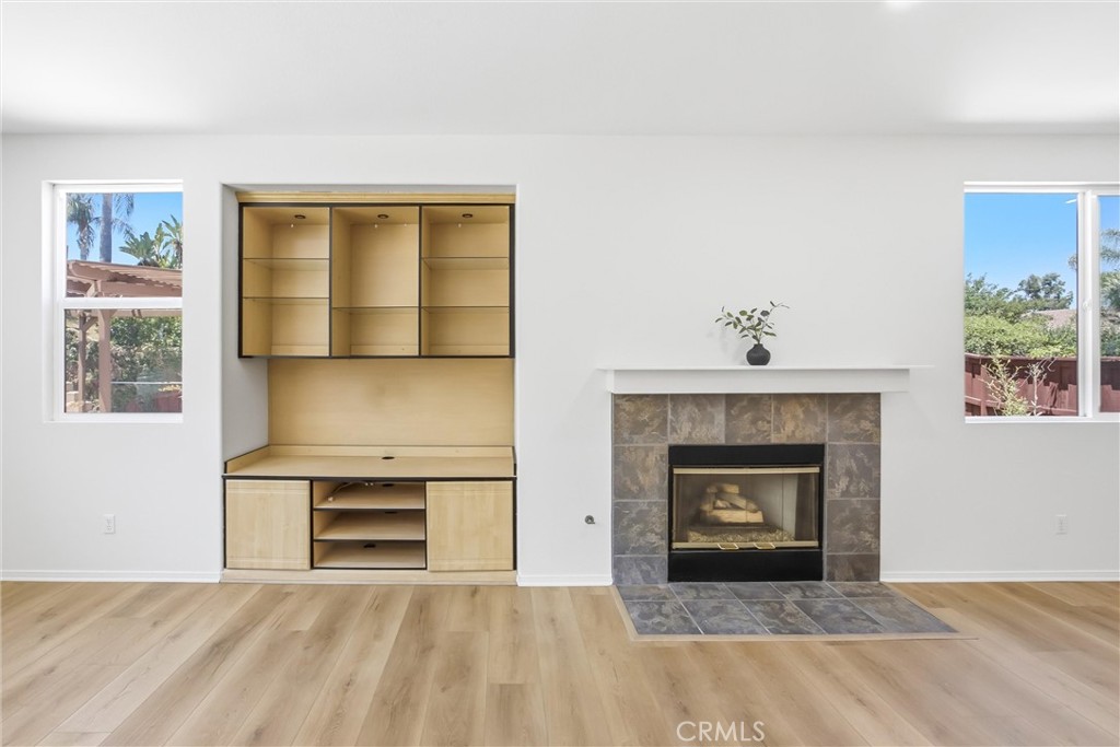 8710 Windmill Place Riverside, CA 92508 - Photo 22 of 66 a view of an empty room with a fireplace and a window