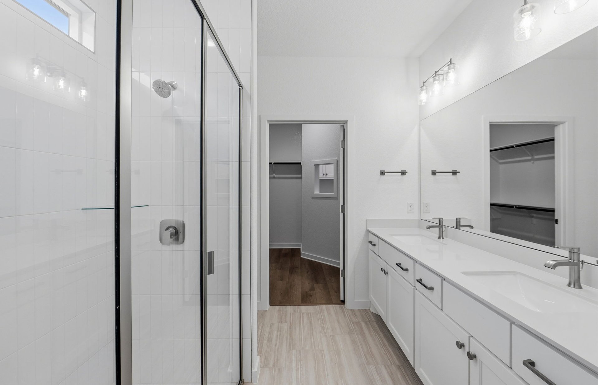 1010 Martingale Street Georgetown, TX 78633 - Photo 9 of 23 a bathroom with a double vanity sink and mirror