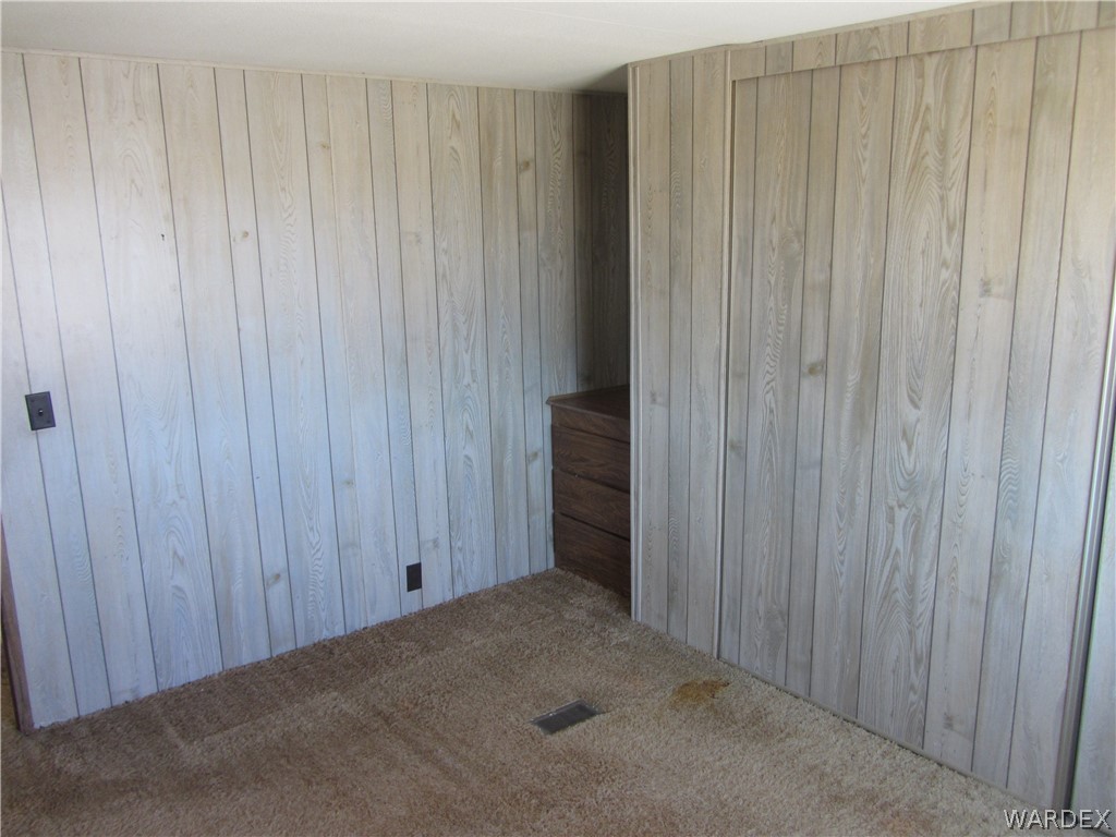 2661 South Jade Road Golden Valley, AZ 86413 - Photo 3 of 21 a view of a room with wooden walls