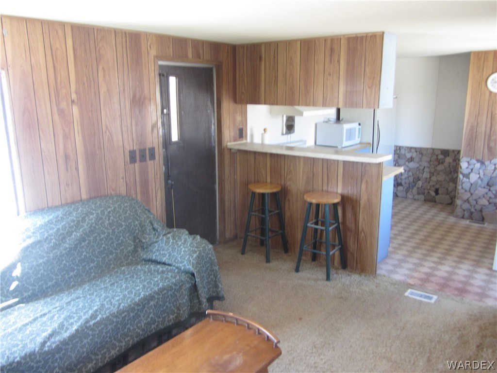 2661 South Jade Road Golden Valley, AZ 86413 - Photo 7 of 21 a living room with furniture and a dining table