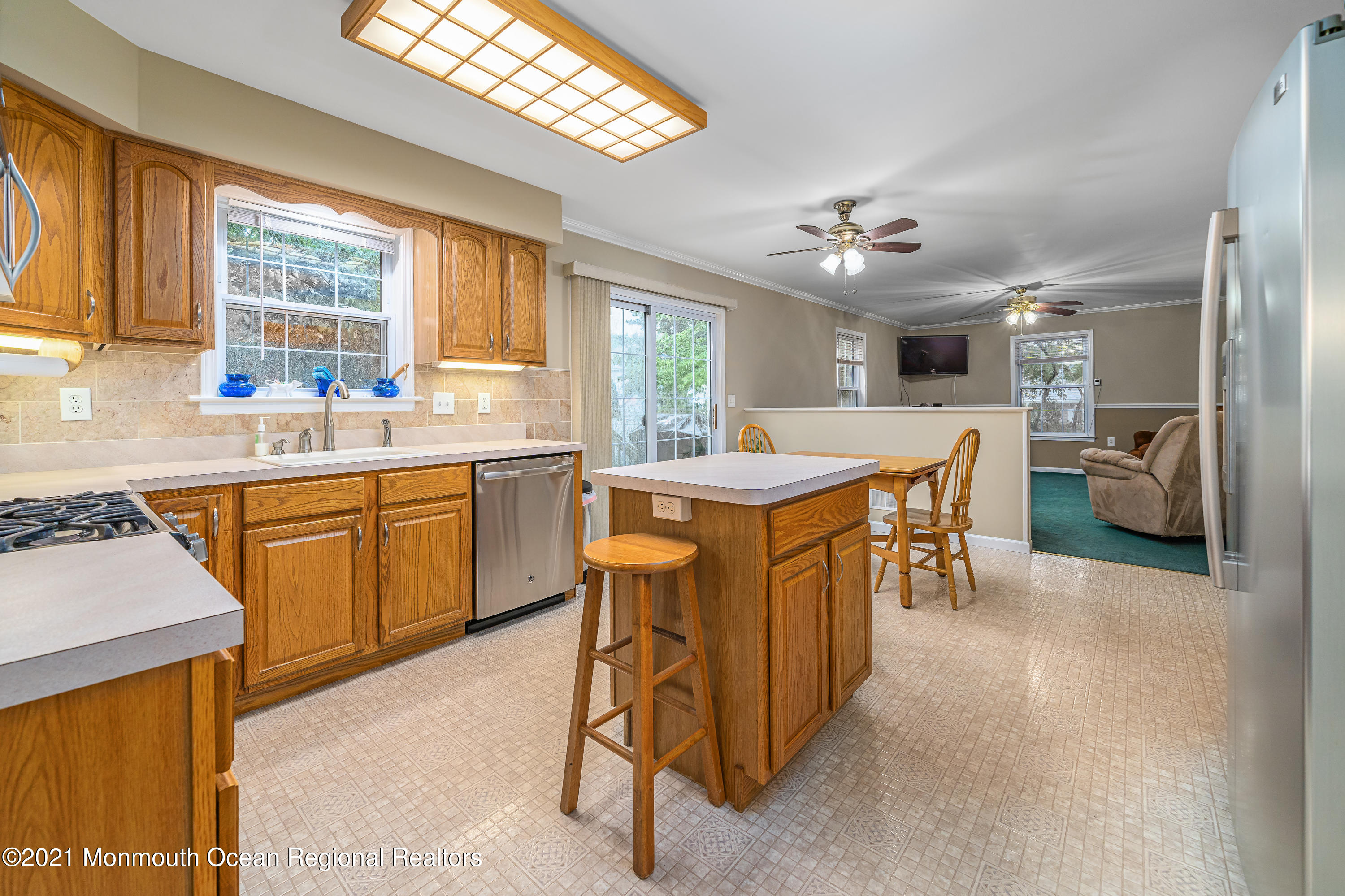 217 Topside Road Manahawkin, NJ 08050 - Photo 11 of 35 a kitchen with a sink a counter top space and stainless steel appliances
