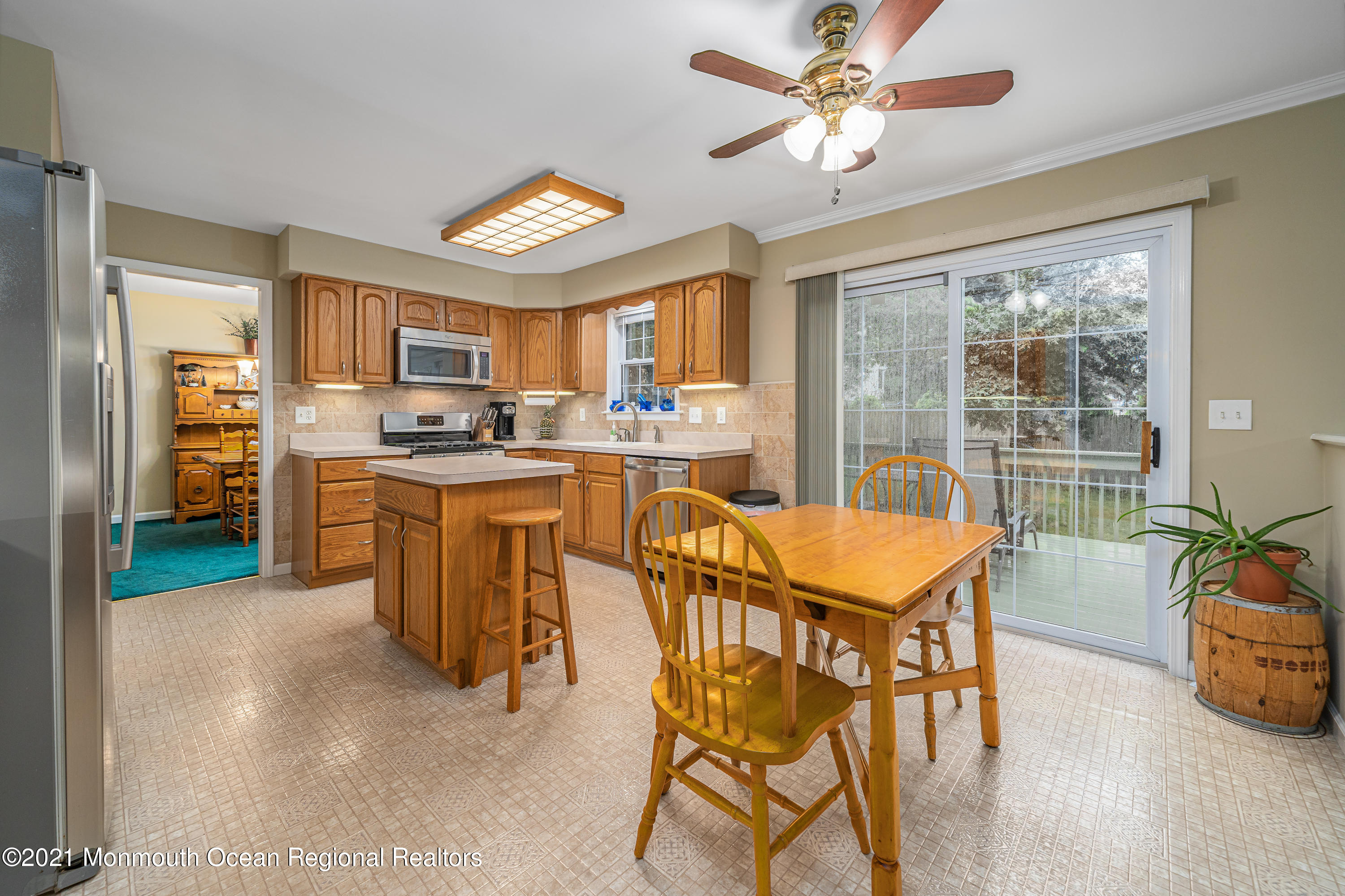 217 Topside Road Manahawkin, NJ 08050 - Photo 12 of 35 a dining room with furniture and a kitchen view