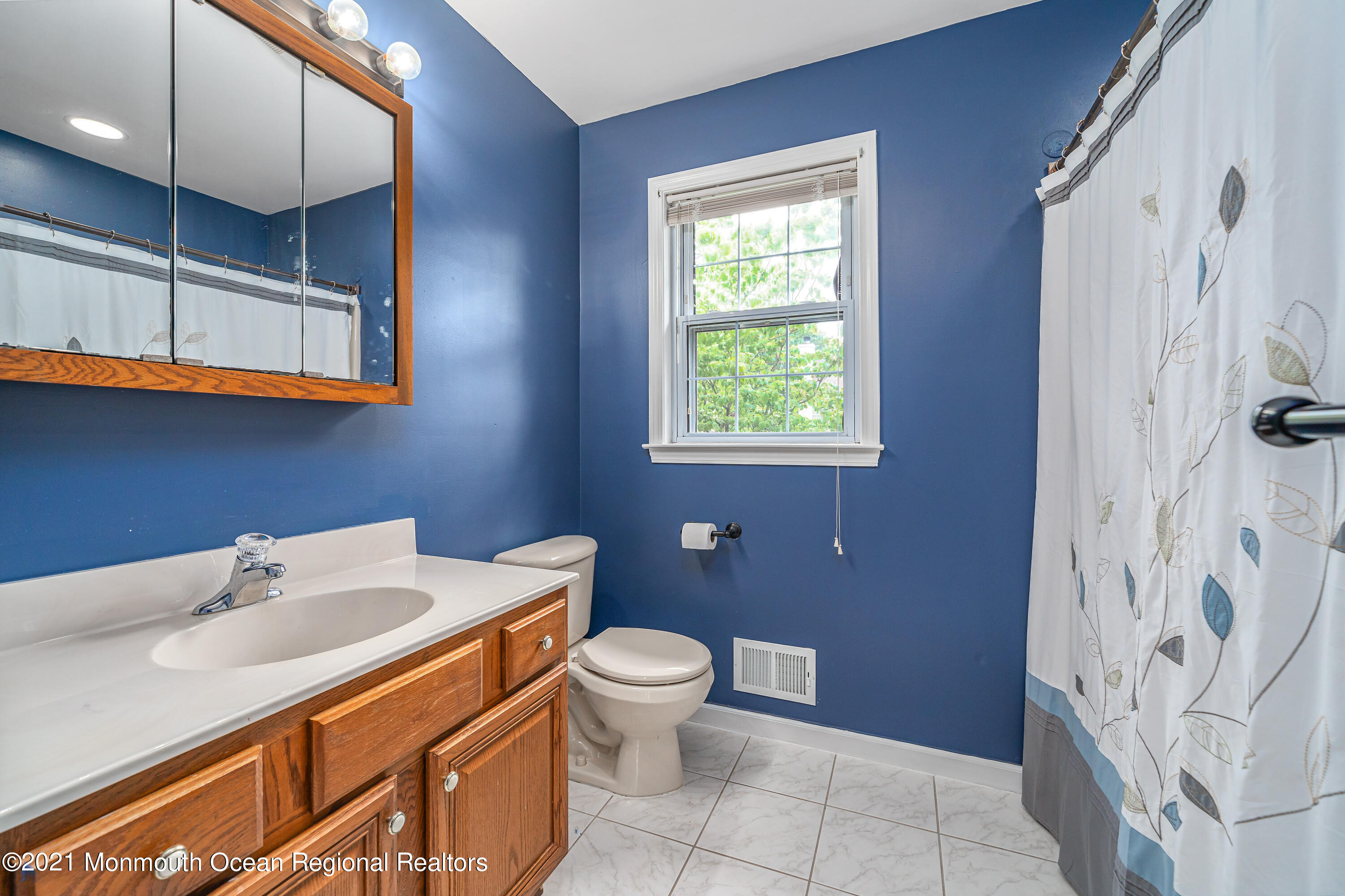 217 Topside Road Manahawkin, NJ 08050 - Photo 20 of 35 a bathroom with a sink a toilet and shower