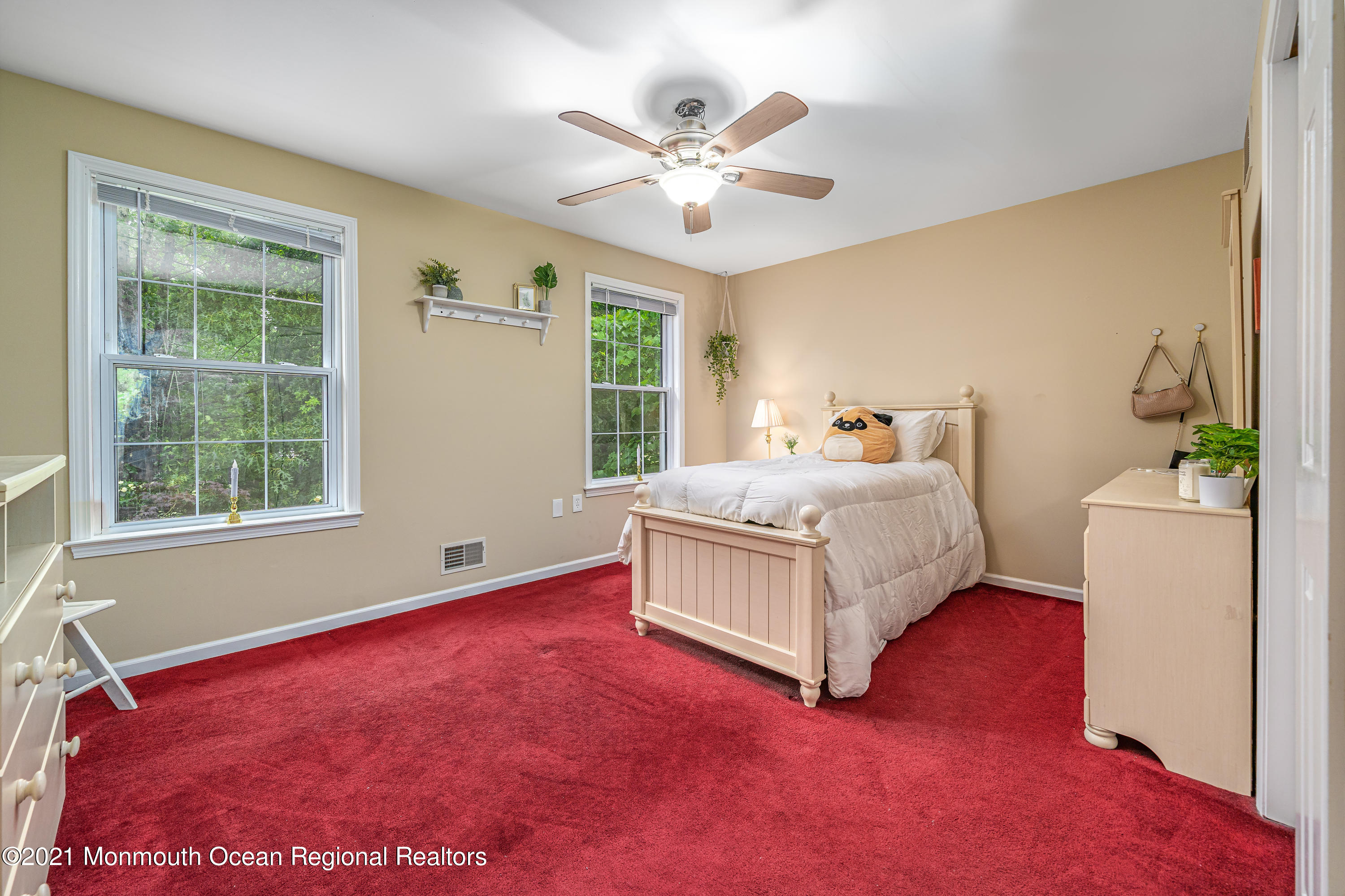 217 Topside Road Manahawkin, NJ 08050 - Photo 22 of 35 a living room with a bed furniture and a window