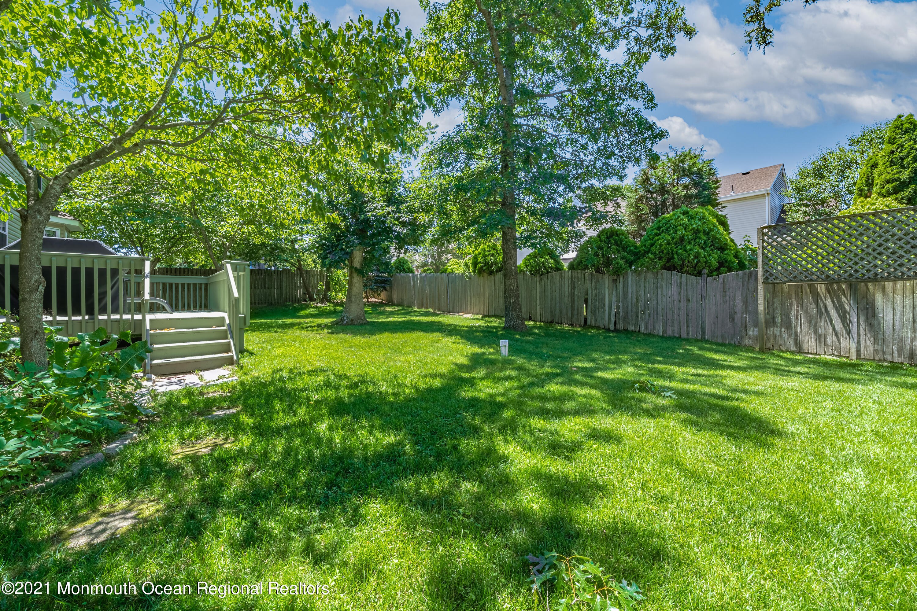 217 Topside Road Manahawkin, NJ 08050 - Photo 23 of 35 a backyard of a house with lots of green space